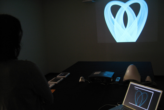 Visitor feeding her heart rate into the installation